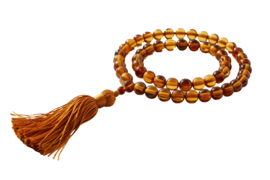 A beautiful amber-like prayer bead strand (tasbih) with a decorative tassel, featuring translucent orange-brown beads, isolated. background removed