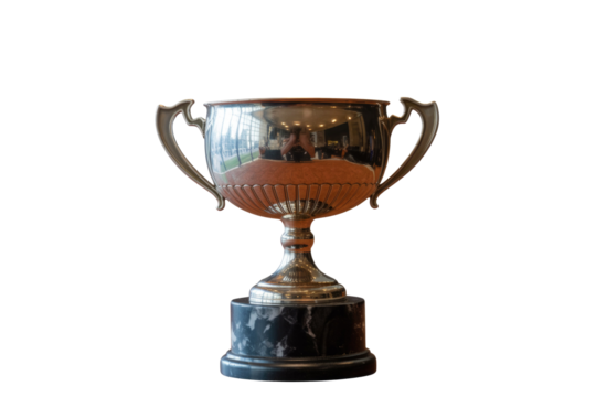 Gleaming silver trophy cup with elegant handles on a polished black marble base, symbolizing achievement and success. background removed