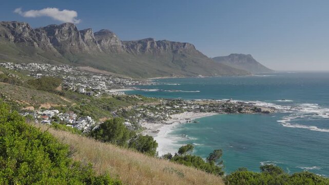 View of the Atlantic Seaboard from The Rock view site at Bantry Bay showing Clifton Beach, Camps Bay and the 12 Apostles. Cape Town. Western Cape. South Africa. 30fps footage captured in 4k 60p.
