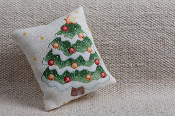 Christmas tree cushion on sofa