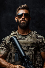 Soldier in Camouflage Uniform with Gun