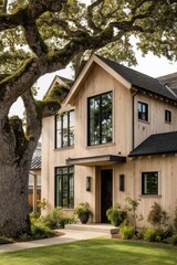 Charming modern wood house surrounded by lush greenery and large oak tree in a serene neighborhood during bright daylight