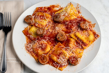 spinach and mushroom ravioli top with chicken sausage