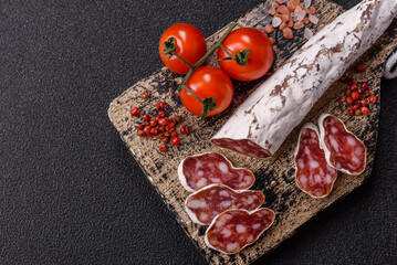Dry Spanish salami sausage fuet as a snack for the dinner table. Fuet sausage