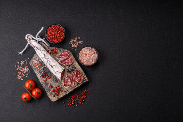 Dry Spanish salami sausage fuet as a snack for the dinner table. Fuet sausage