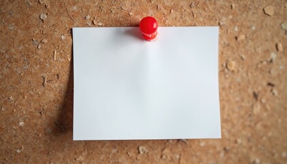 Blank white paper note securely pinned to aged, textured brown corkboard. Vibrant single red pushpin firmly holds empty sheet. Versatile background offers clear copy space for important information,