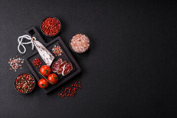 Dry Spanish salami sausage fuet as a snack for the dinner table. Fuet sausage