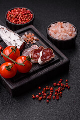 Dry Spanish salami sausage fuet as a snack for the dinner table. Fuet sausage