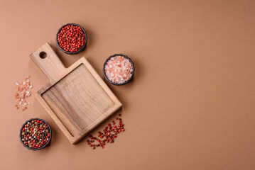 Wood, a wooden empty cutting board on a dark kitchen table. Wooden cutting board