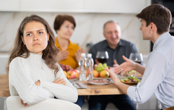 Offended girl turned away from her family during a holiday dinner with her parents at home