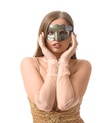 Beautiful young woman wearing carnival mask on white background