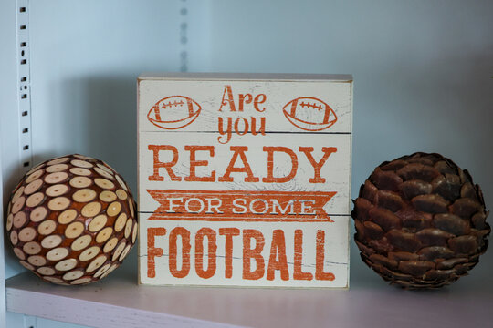 decorative sign that says Are You Ready For Some Football in a house. Sports fan decoration for a living room. 