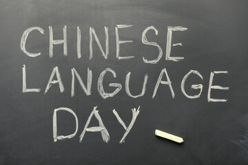 Text CHINESE LANGUAGE DAY on black chalkboard