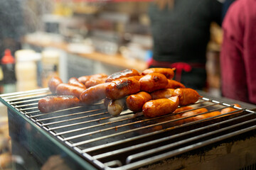 Grilled sausages on street food market