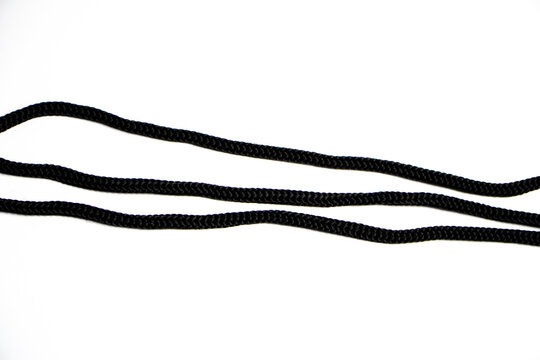 abstract shape on white background. abstract line background. Black rope isolated on white. close up black of rope isolated on white background. Saving clipping paths knot twisted