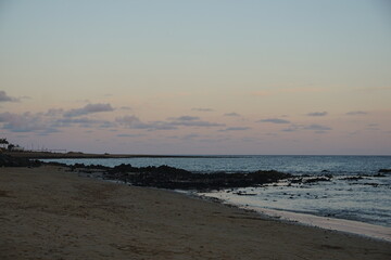 beach, sand, rocks, volcanic island, atlantic ocean, coastline, shore, sunset, lanzarote, matagorda, puerto del carmen, November 2025