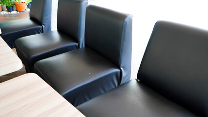 chairs in a conference room. Empty Black red outdoor chair in cafe at the mall. With metal black table. At the foodcourt for lunch.
