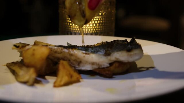 Typical British Pub Food famous Fish and Chips drizzle with baked lemon juice. High quality 4k footage