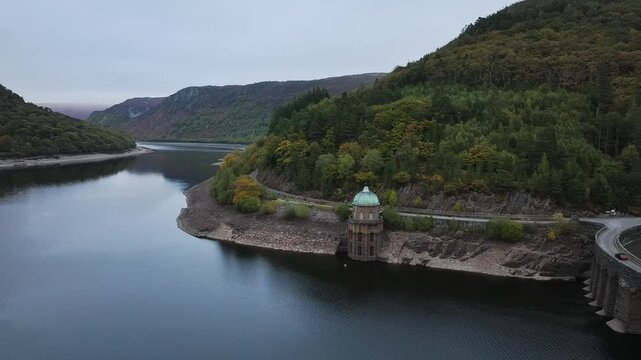 Autumn over Garreg Ddu Dam from a drone, Elan Valley, Caban-Coch Reservoir, Rhayader, Wales, UK