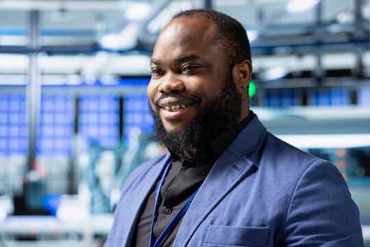 Factory inspector in business attire performing analysis on solar energy systems, emphasizing process monitoring and infrastructure development. Industrial engineering in solar plant. - Powered by Adobe