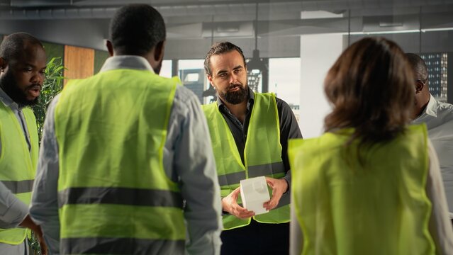 Colleagues in real estate and architecture working together on project design and development. The diverse staff focuses on innovation, urban planning, and sustainable property investment.