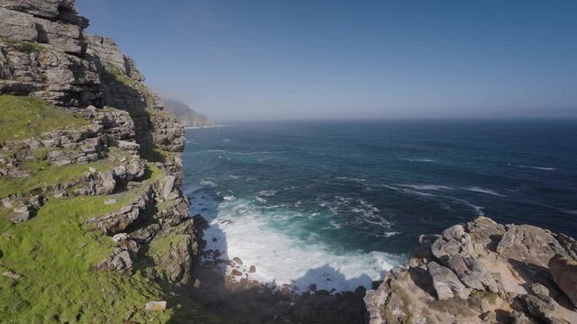 View of Cape Point from the Cape of Good Hope with the upper lighthouse shrouded in mist, which is why the lower one was built. Table Mountain National Park. Cape Town. Western Cape. South Africa.: