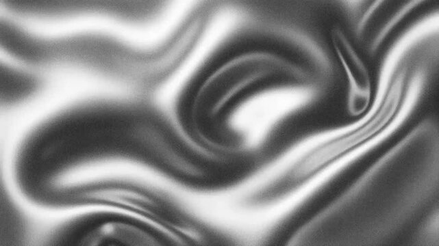 Abstract swirling pattern with smooth textures in shades of gray.