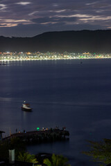 Fototapeta premium Lights at Bombinha beach on sunset