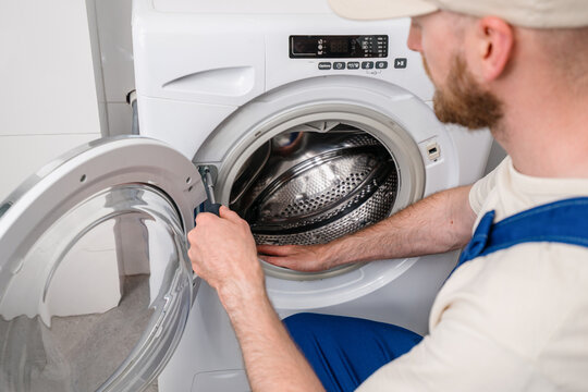 Repairing a washing machine at home to ensure efficient laundry service