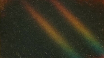 A faded abstract background featuring streaks of color resembling rainbow tones against a textured dark canvas. - Powered by Adobe