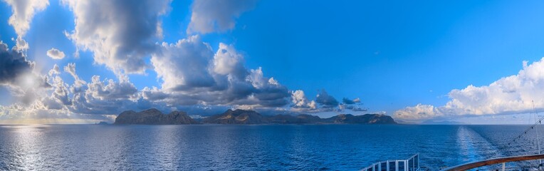 Panoramic view from cruise ship of ​​the Sicilian coast near Palermo, southern: the Capo Gallo Nature Reserve in the center.
