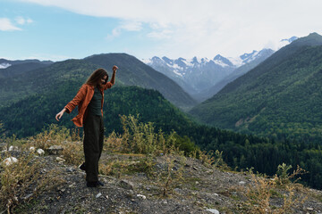 Naklejka premium Mountain hiker in nature on rugged landscape, person standing on ridge with solitude and wilderness around, journey and freedom captured in wide view, authenticity inclusivity