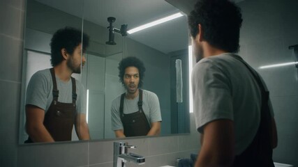 Man looking in bathroom mirror self reflection visual concept