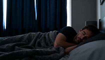 Obraz premium Man sleeping in with curtains closed, cozy lifestyle photo with soft light and minimal bedroom decor