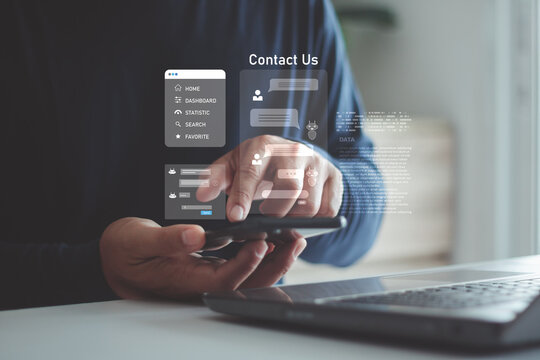 A person using a smartphone and laptop with digital chat and contact us icons, online communication, customer support, virtual assistance and modern technology solutions for business interaction.