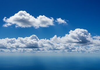 Vibrant blue sky with fluffy white clouds and horizon line