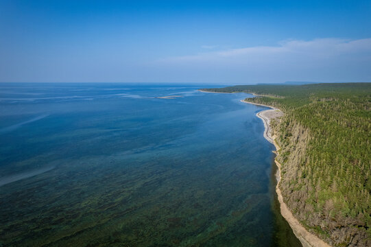Coastal Cliff, Layered Rock Formations and Boreal Forest at English Head on a Sunny Day in Anticosti, Quebec, Canda