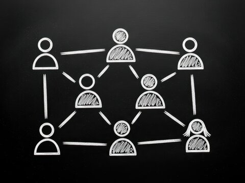 Hand drawn chalk sketch of a social network connecting diverse user icons on a black blackboard, symbolizing teamwork, corporate structure, and successful communication strategy. - Powered by Adobe