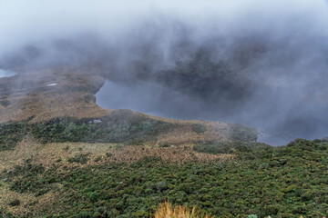 Mountain lake shrouded in mist, in a landscape rich in biodiversity in the Colombian Andes. Birthplace of the Magdalena River.