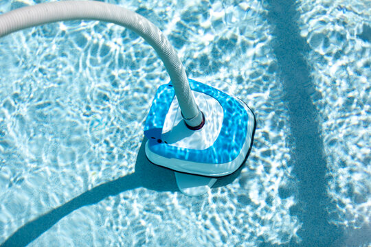 close up of self-propelled Automatic pool vacuum on the bottom of a deep pool