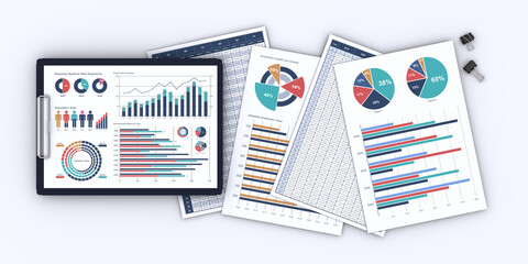 ビジネス資料、ビジネスデータをプリントした書類とクリップボード