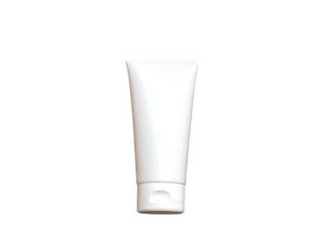 A blank white squeezable tube with a cap, positioned centrally on a black background with soft lighting