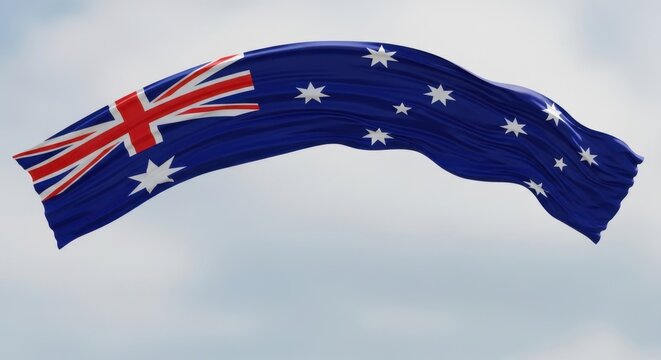 Waving australian flag against a cloudy sky. Symbol of australia and national pride.