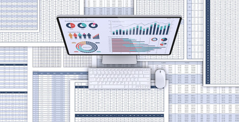 ビジネス資料とデータを表示するデスクトップパソコン、データ分析・検討のイメージ