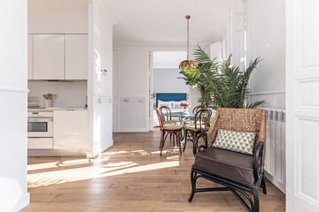 Living room with furniture  clean lines, a low-profile sofa, and a floating tempered glass shelf