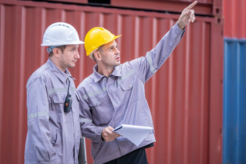 Construction safety briefing warehouse site professional meeting outdoor environment mid-range view teamwork concept