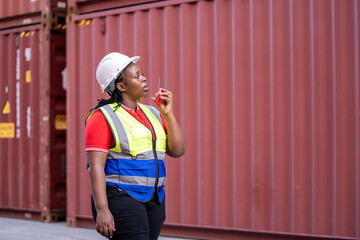 Construction worker assessing site conditions shipping yard professional photo urban environment direct view safety awareness