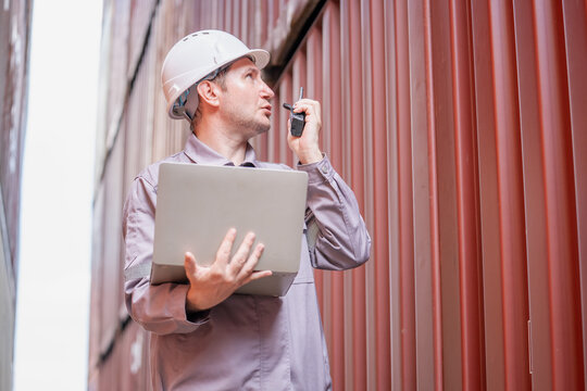 Shipping logistics manager communicates at cargo area import-export hub business environment professional view efficiency concept