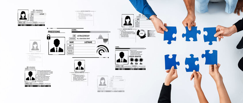 Diverse hands collaborate to assemble puzzle pieces symbolizing teamwork with identity profiles and data processing elements in a modern office environment. Trope - Powered by Adobe