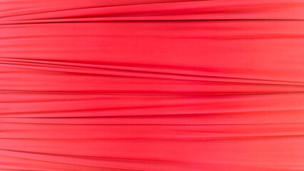 Red Fabric Texture With Soft Horizontal Folds on White Isolated Background